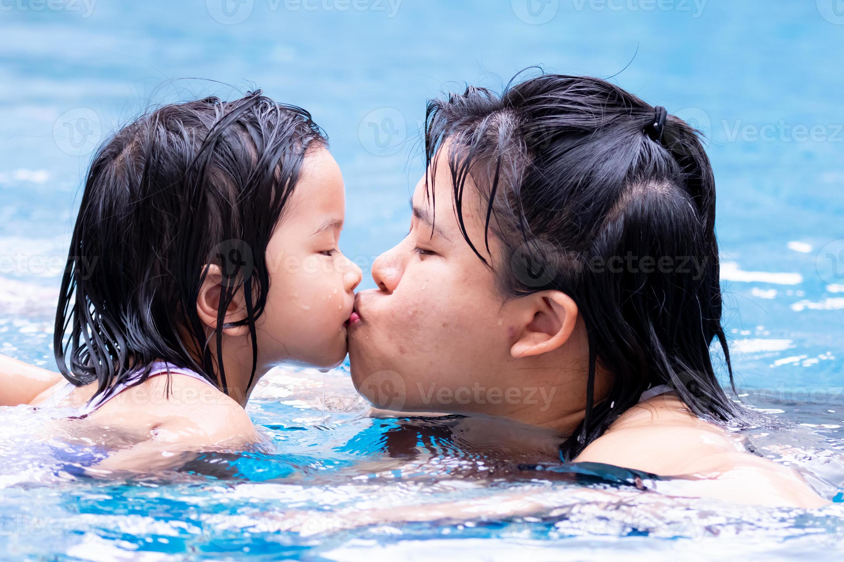 denise guth add naked asian girls kissing in pool photo